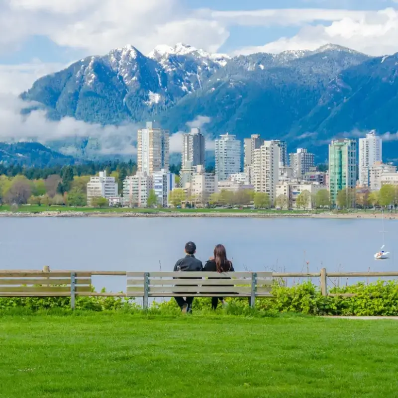 Couple sitting on a bench in Downtown of Vancouver, Canada