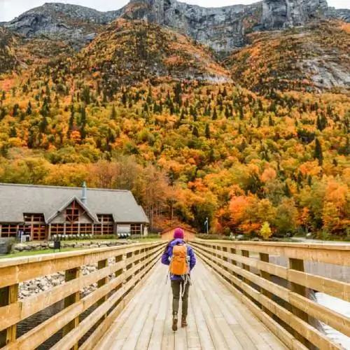 Girl on nature hike with travel insurance for Canada