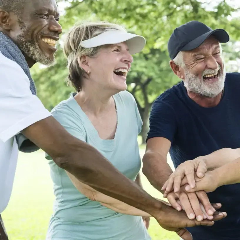 Older friends exercising with Commonwealth seniors health card