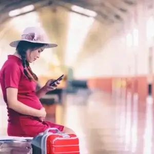 Pregnant woman on trip with travel insurance