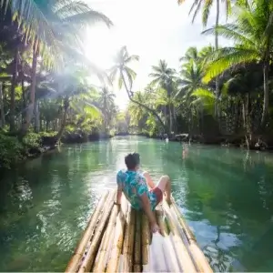 Tourist on bamboo raft with one-way travel insurance