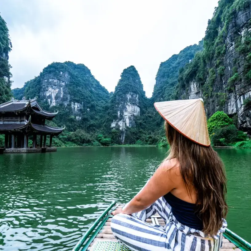 Tourist with travel insurance for Vietnam on a boat
