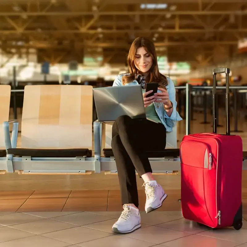 Woman at airport checking her flight information