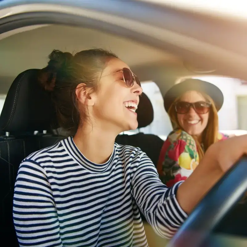 Woman driving with her friend