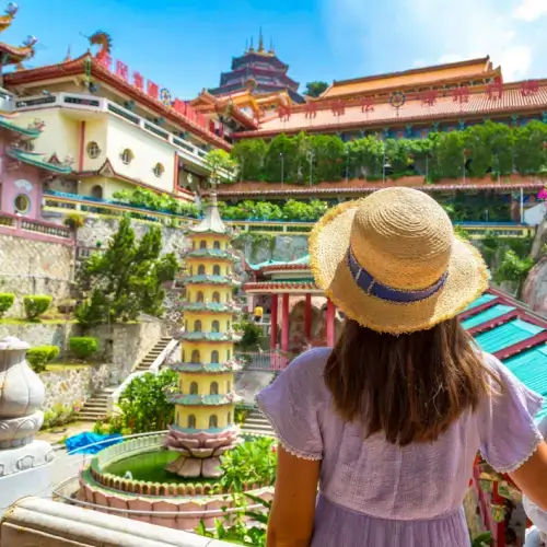 Woman tourist with travel insurance for Malaysia at Kek Lok Si Temple