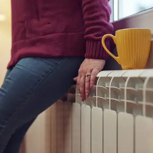 Woman with a gas heater