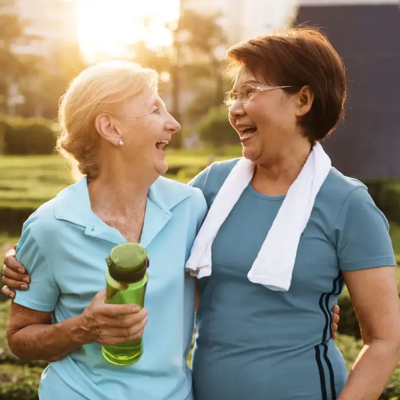Two old women exercising and holding each others arms