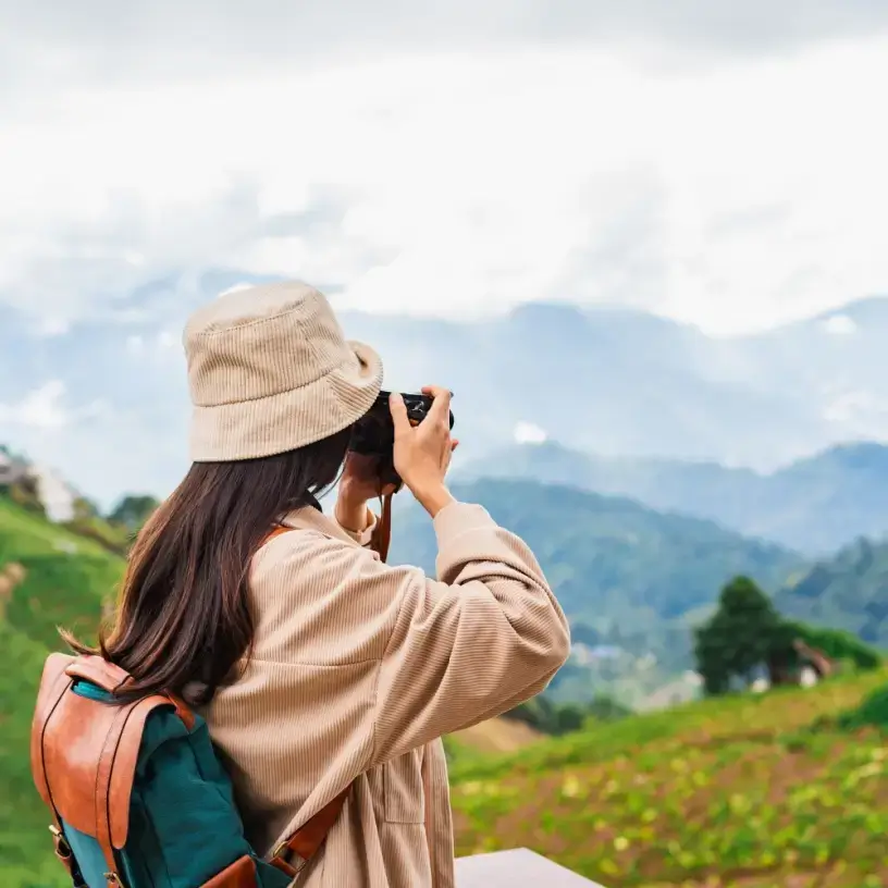 Women tourist taking photo of the mountains