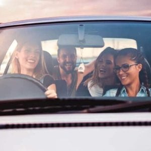 Young friends enjoying a road trip.