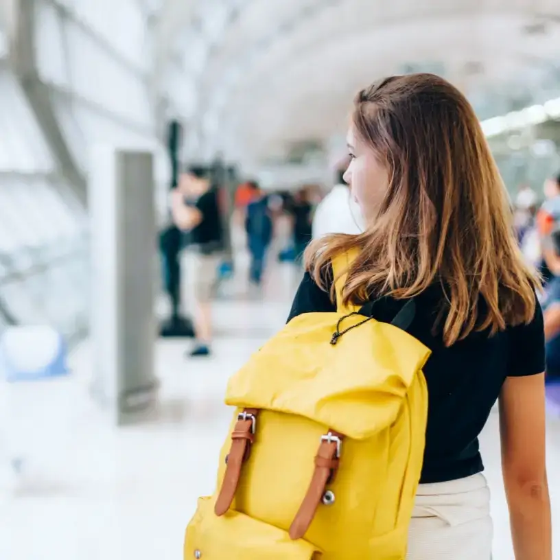 Young girl at airport travelling alone