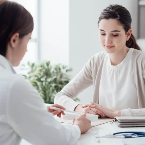 Woman talking to a doctor