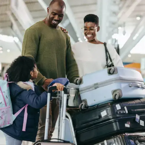 Young family at the airport having bought travel insurance online