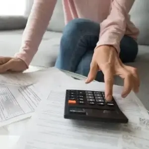 woman calculating extra repayment benefits