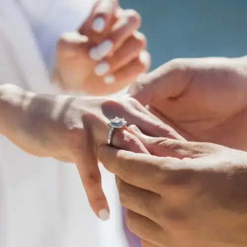 Close up of woman wearing engagement ring