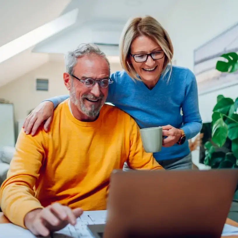 Couple searching for home and contents deals online