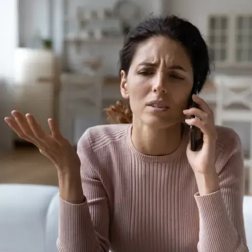 woman calling bank mortgage stress