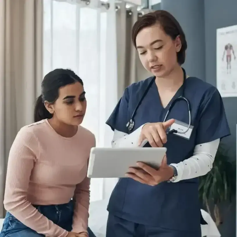 A doctor explains insulin pump costs to patient