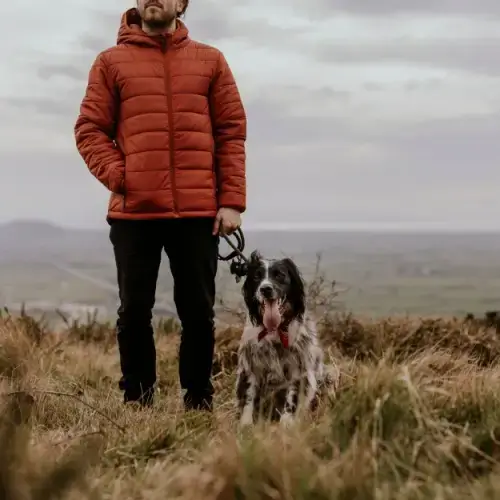 Man walking his dog in cold weather