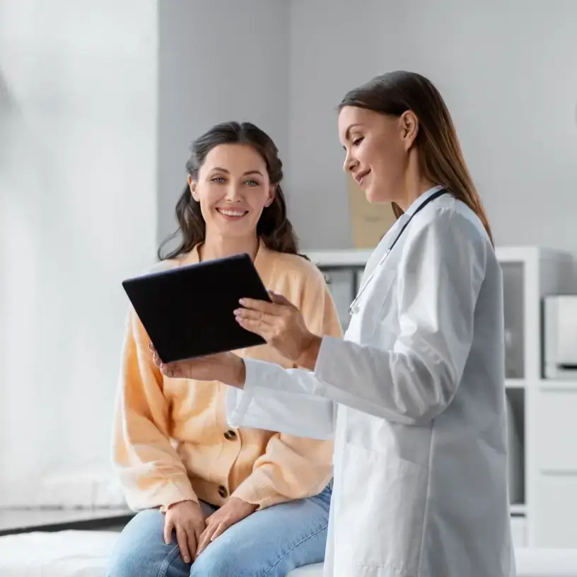Female doctor talking to female patient