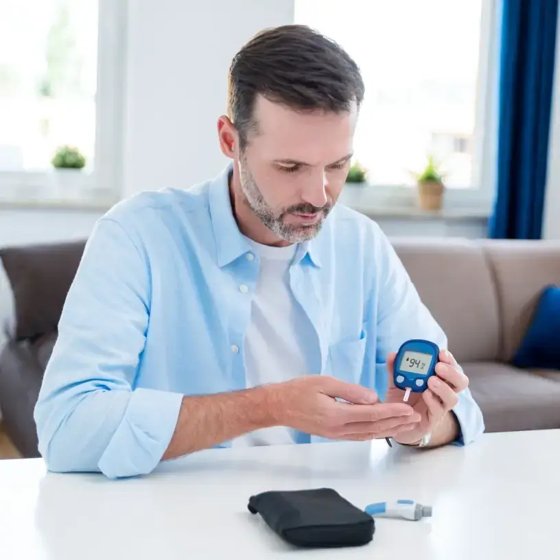 Man with diabetes testing blood sugar
