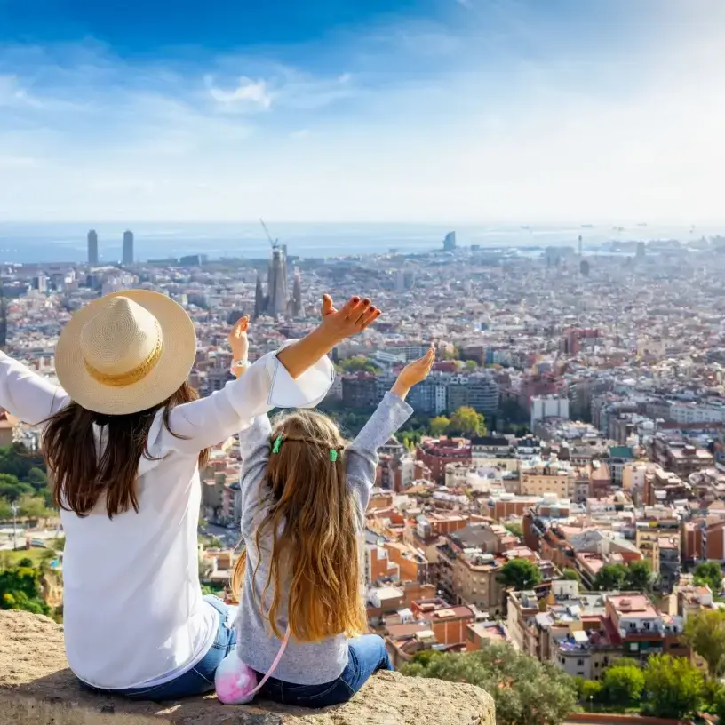 Mother and daughter happy overlooking Barcelona Spain