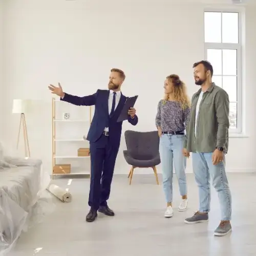 Real estate agent advising clients