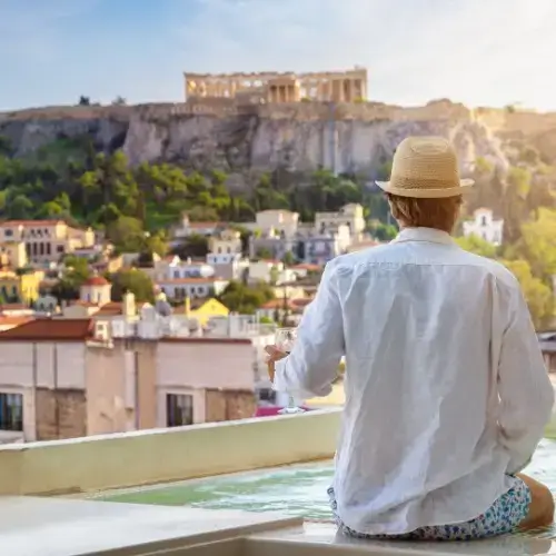 Tourist man with travel insurance for Greece in Athens