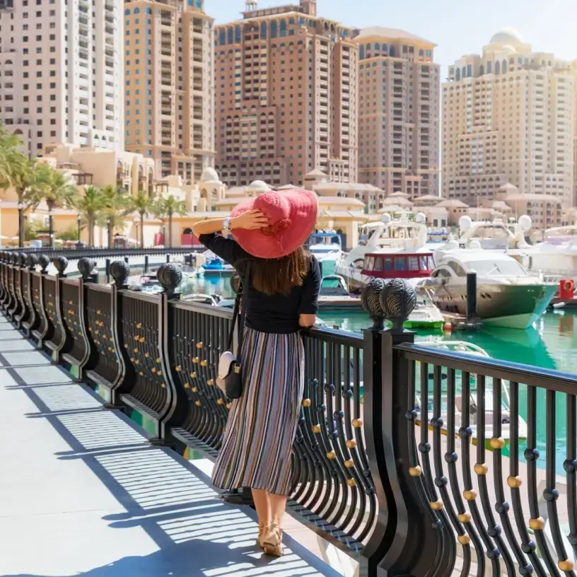Woman tourist overlooking bay in Doha Qatar