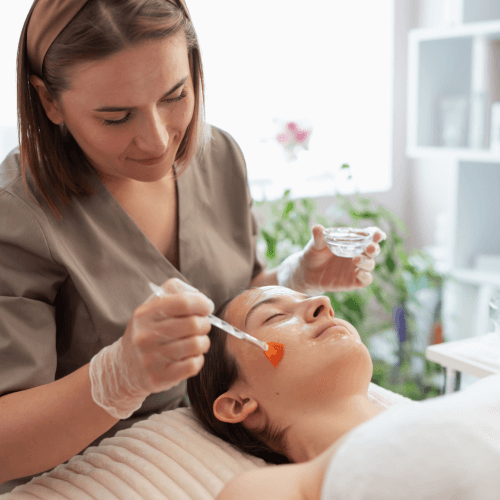 Woman at salon doing facial