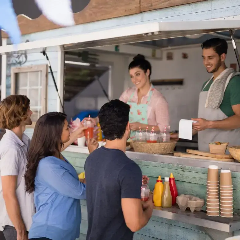 Customers ordering from a food truck