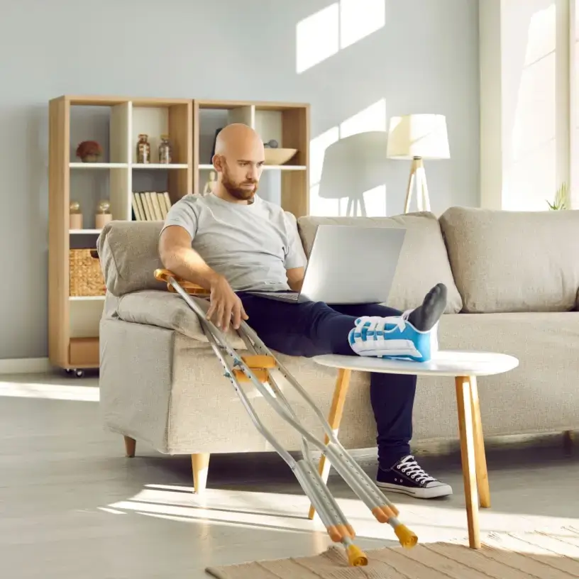 Injured worker looking at his laptop
