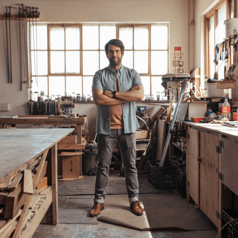 Tradie standing in his tools shed