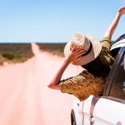 Woman on road trip in Australia with travel insurance