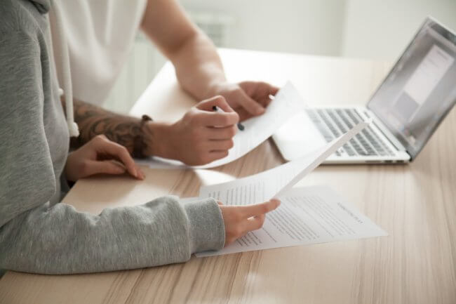 Couple reading through contract