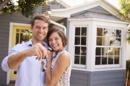 Couple holding keys to new home