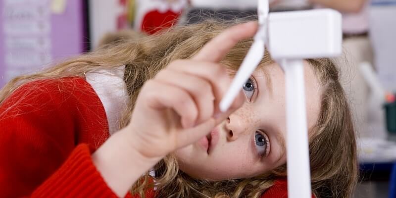 Child looking at a windmill