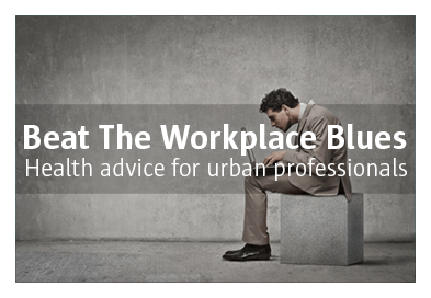 a man squinched over a laptop - symbol for the workplace blues