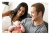 parents holding a baby