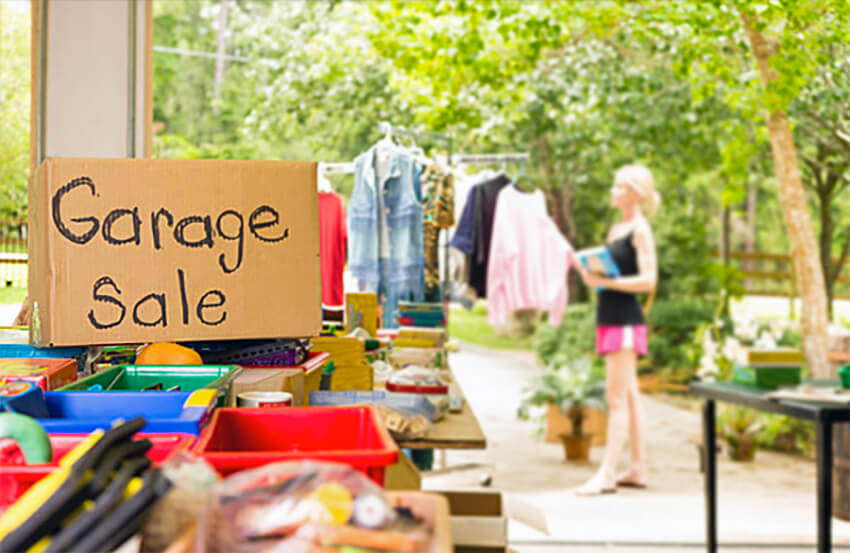 garage sale with girl in the background