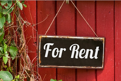 for rent sign on a red wooden door