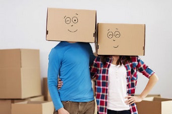 cardboard boxes wren as a face mask by a couple