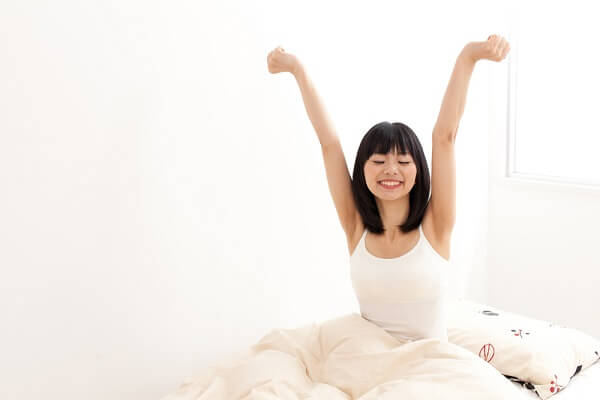 girl stretching - symbol of improving the quality of sleep
