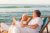 old men and women sitting on the beach