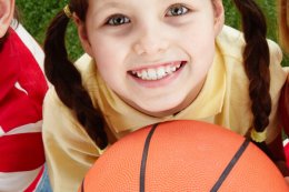 aussie-kids-smiling-and-holding-soccer-ball-and-basketball