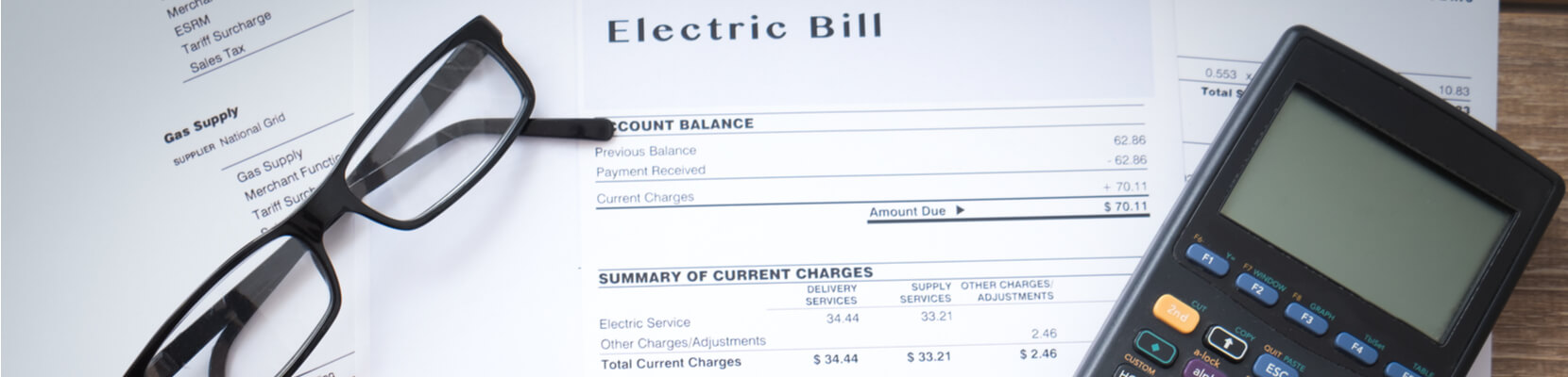 Electricity bill with glasses and calculator