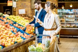 A couple grocery shopping