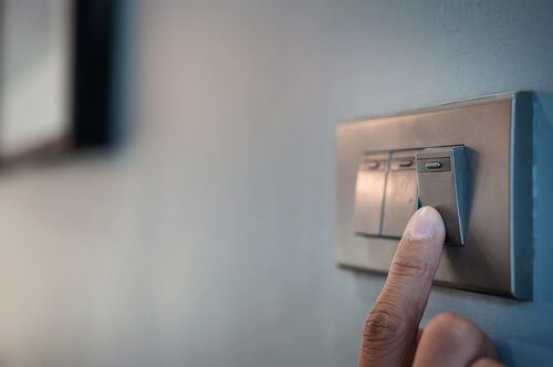 Close up of person switching on power