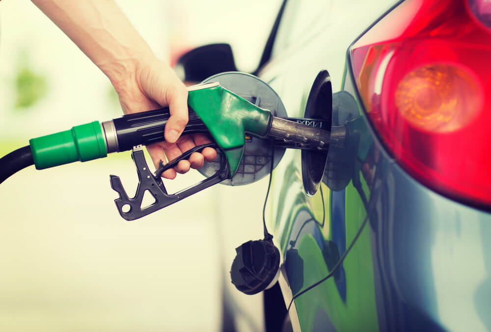 An Australian filling up their car at a service station.