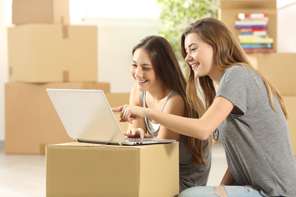 two young renters searching on the internet to answer what is renters insurance