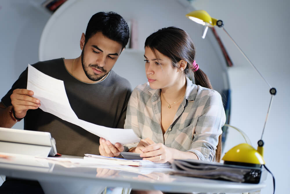 Couple filing tax return and looking over the Medicare Levy